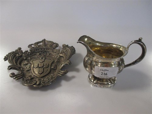 Lot 216 - A Russian silver cream jug and a continental...