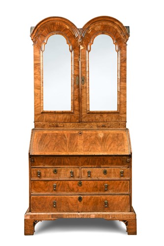 Lot 388 - A Queen Anne walnut double dome bureau bookcase