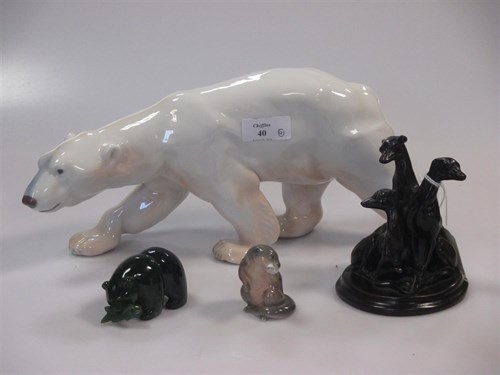 Lot 40 - A Royal Copenhagen polar bear, a resin...