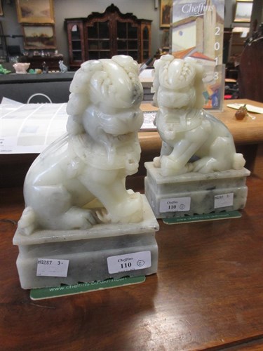 Lot 110 - A pair of Qilin, 18cm high (2)