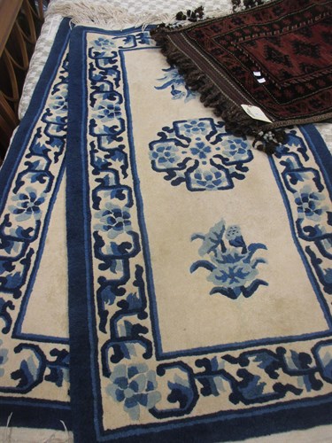 Lot 463 - Two blue and white Chinese rugs, and a tribal...