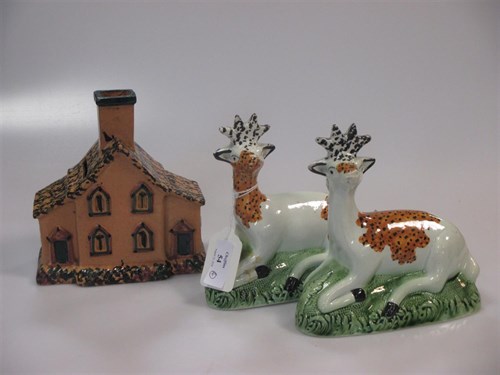 Lot 54 - A pair of 18th century pearlware deer together...