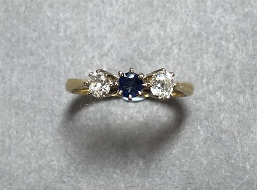 Lot 260 - A sapphire and diamond three stone ring set in 18ct gold