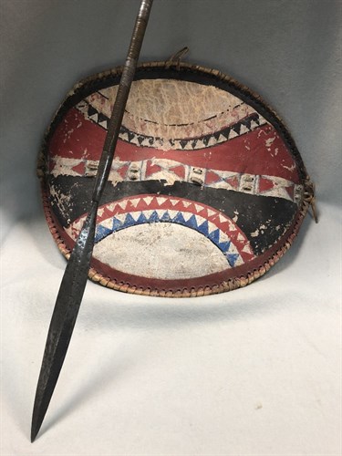 Lot 251 - A tribal shield and a spear, possibly Masai