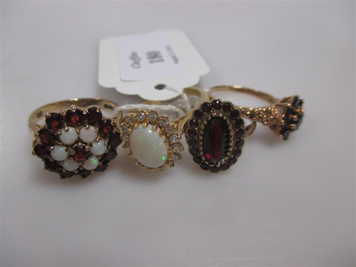 Lot 180 - An opal cluster ring set in hallmarked 18ct...