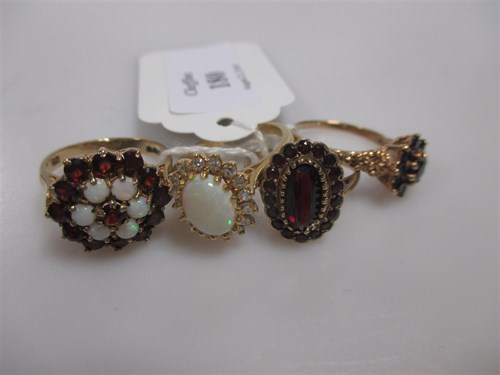 Lot 180 - An opal cluster ring set in hallmarked 18ct...