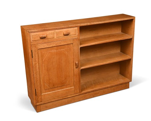 Lot 224 - A Cotswold school oak bookcase in the manner of Peter Waals (1870-1937)