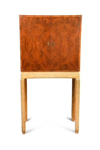 Lot 242 - An Art Deco oyster veneered yew wood cabinet on stand