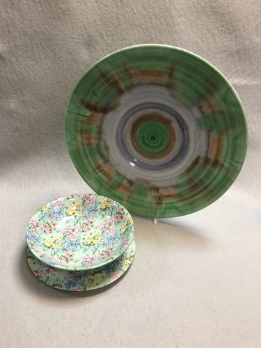 Lot 56 - A Shelley Harmony charger, glazed in greens,...
