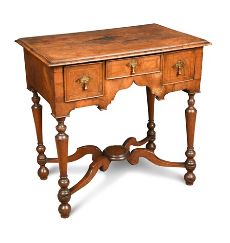 Lot 378 - An early 18th century and later walnut lowboy