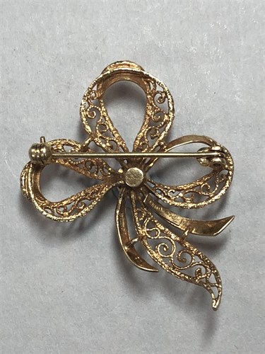 Lot 310 - A gold and cultured pearl  brooch by Andreas Daub together with a two row cultured pearl necklace