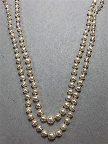 Lot 310 - A gold and cultured pearl  brooch by Andreas Daub together with a two row cultured pearl necklace