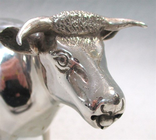 Lot 129 - A Victorian silver semi naturalistic cow creamer