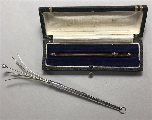 Lot 223 - Two swizzle sticks