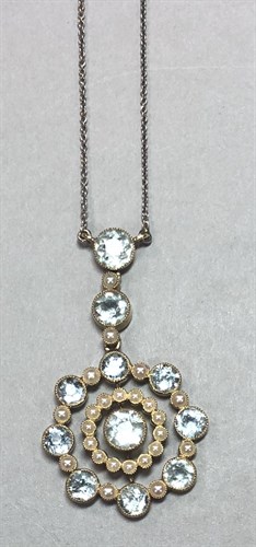 Lot 295 - An Edwardian aquamarine and seed pearl pendant with chain