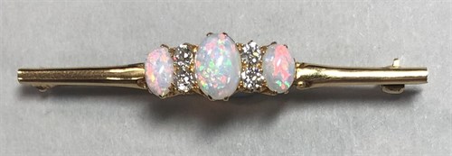 Lot 352 - An opal and diamond seven stone bar brooch