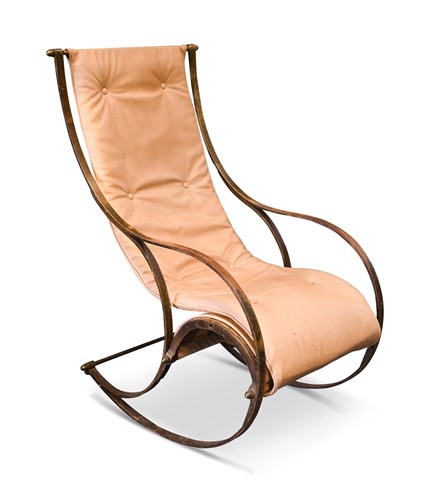Lot 229 - An early 20th century bent steel rocking chair in the manner of R. W. Winfield