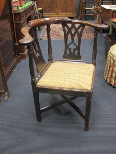 Lot 435 - A George III mahogany corner armchair, with...
