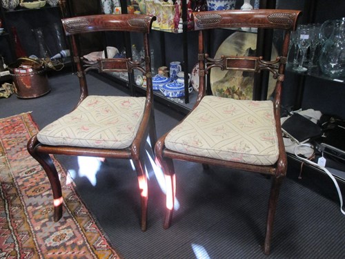Lot 401 - A set of four 'Faux' rosewood Regency dining...