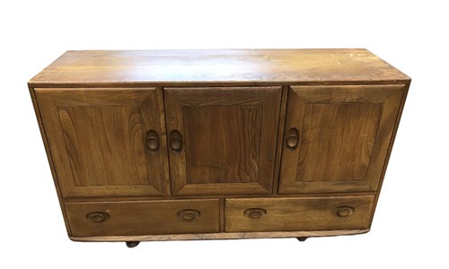Lot 289 - An Ercol elm sideboard