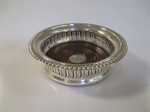 Lot 229 - A modern silver wine coaster, with a draught...