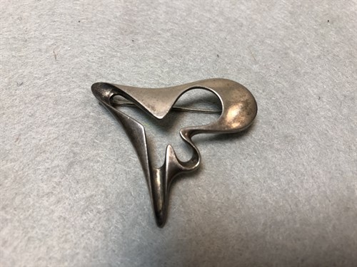 Lot 126 - Georg Jensen, a Danish metalwares brooch designed by Henning Koppel, No. 324