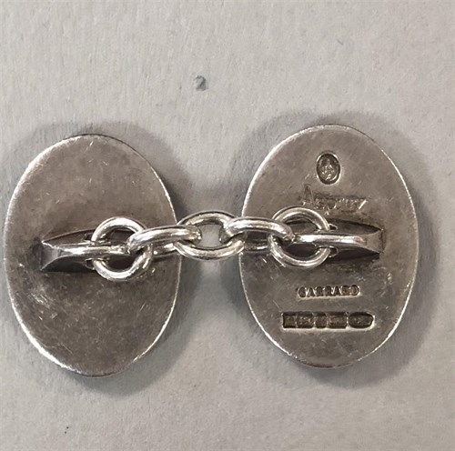 Lot 360 - A pair of Sterling silver and guilloché enamel cufflinks by Asprey & Garrard