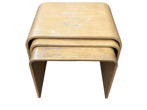 Lot 303 - A nest of three bent plywood tables, each with...