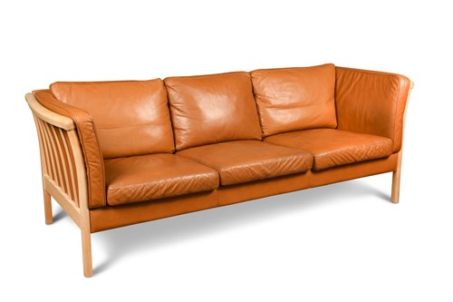 Lot 257 - Stouby, a Danish cognac leather three-seater sofa