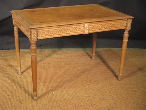 Lot 336 - A Continental carved beech wood library table...