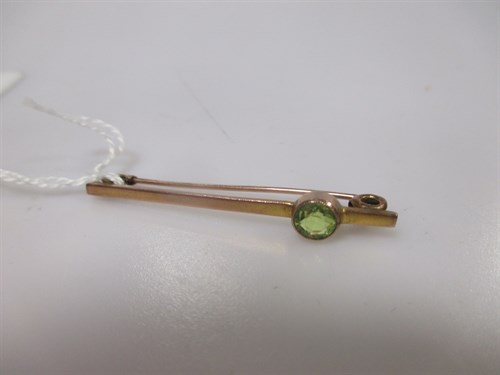 Lot 142 - A bar brooch marked '9ct' set with a single...