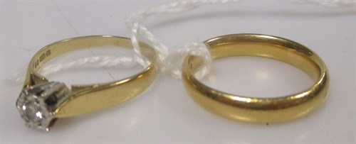 Lot 166 - A 22ct gold wedding ring, 5.4g, and an 18ct...