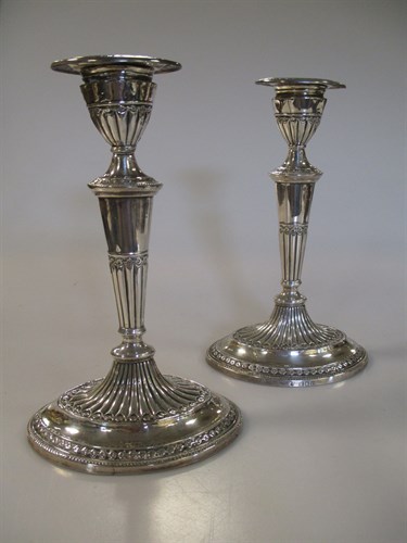 Lot 227 - A pair of Victorian silver dwarf candlesticks,...
