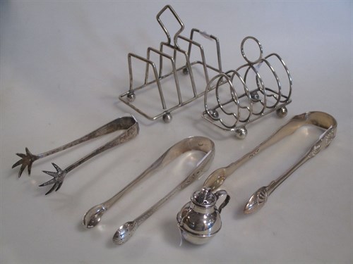 Lot 217 - Two silver toastracks, two pairs of silver...