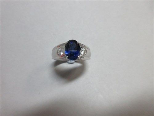 Lot 275 - A contemporary 18ct gold sapphire and diamond three stone ring