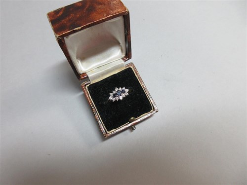 Lot 238 - An 18ct gold sapphire and diamond ring