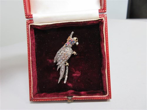 Lot 426 - An antique diamond and gemset parrot brooch