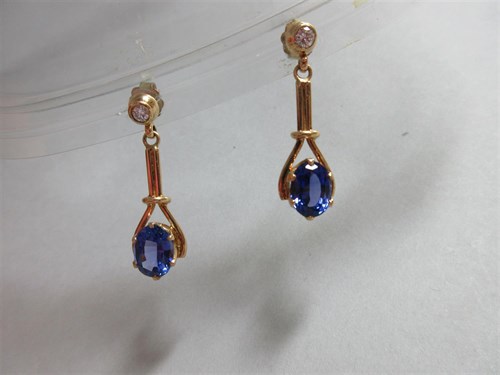 Lot 404 - A pair of diamond and tanzanite pendant earrings