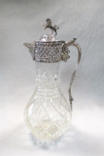 Lot 143 - A silver plated and cut glass claret jug