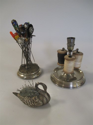 Lot 223 - A silver swan shaped pin cushion, a silver...