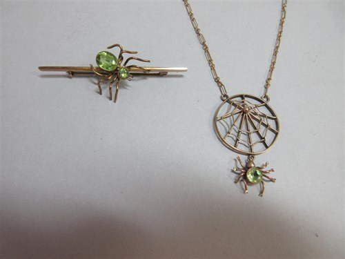 Lot 385 - Two peridot set spider jewels