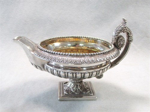 Lot 109 - A George III silver cream jug
