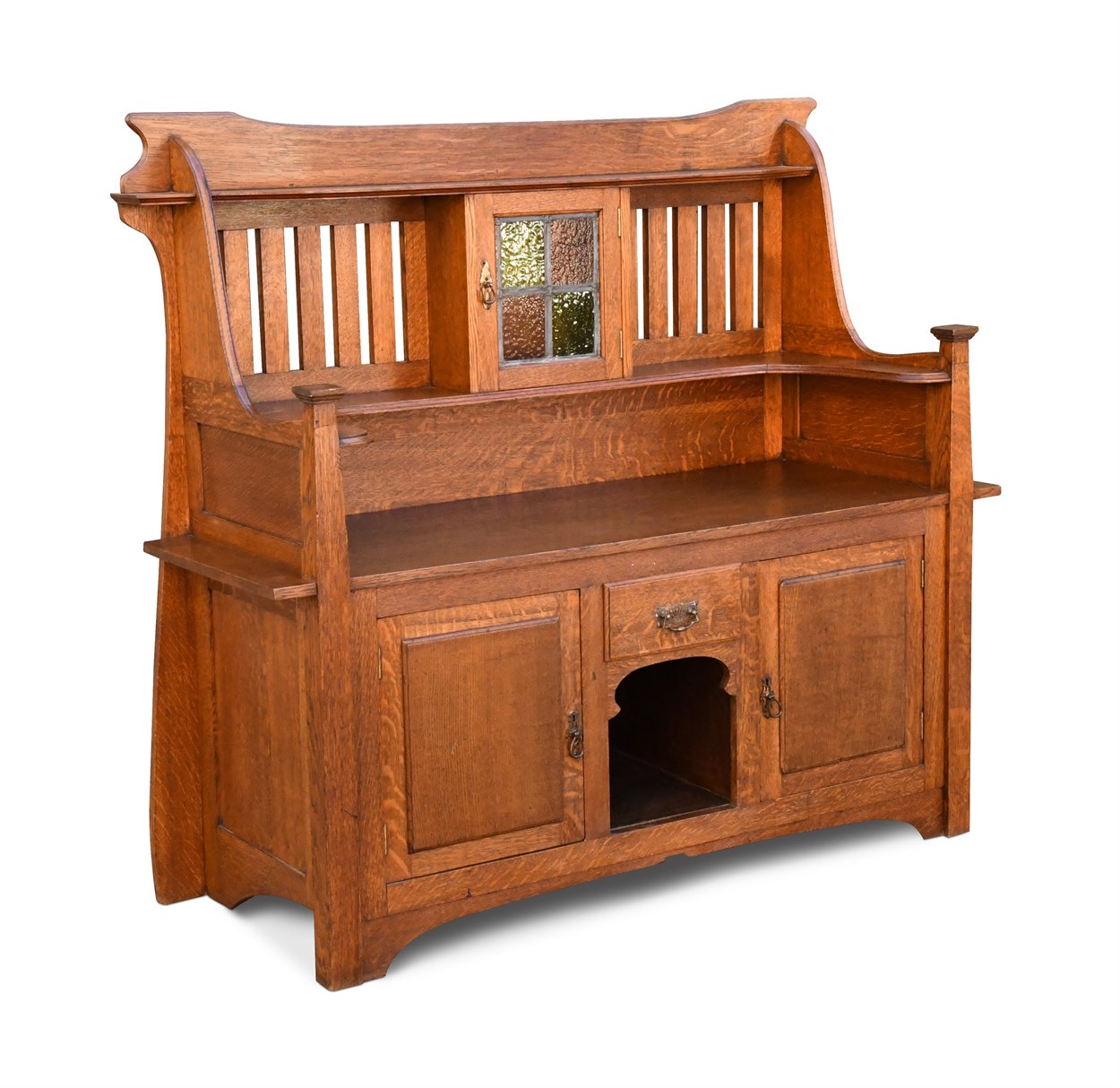 Lot 218 - An Arts & Crafts oak dresser, the slatted back...