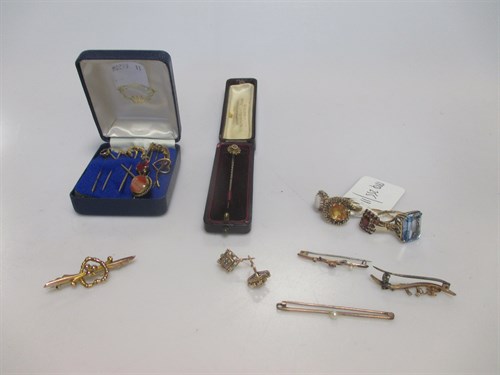 Lot 155 - A collection of gold and stone set pins and...