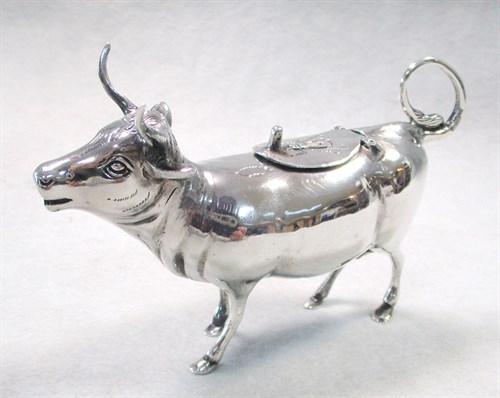 Lot 6 - A German semi naturalistic cow creamer