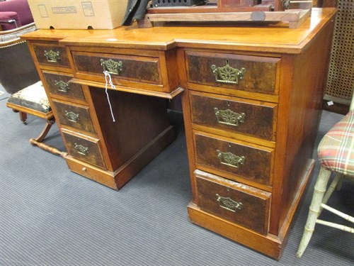 Lot 457 - A late Victorian walnut breakfront kneehole...