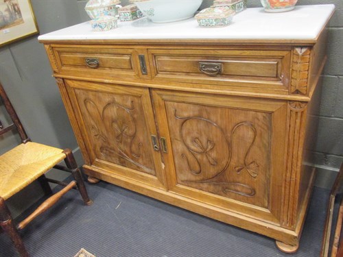 Lot 443 - A 19th century walnut and marble top cabinet...