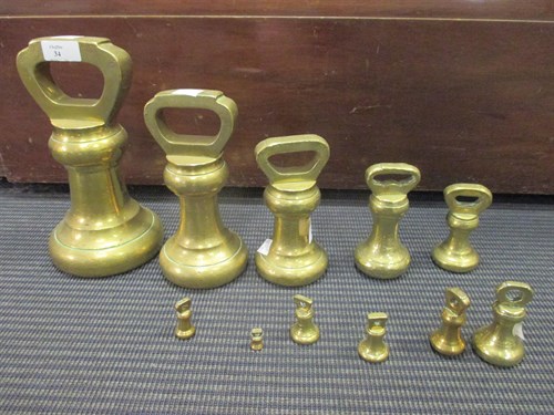 Lot 34 - A graduated set of Avery brass bell weights...