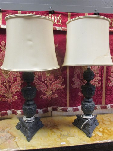 Lot 397 - A pair of heavy cut bronzed lamps in the form...