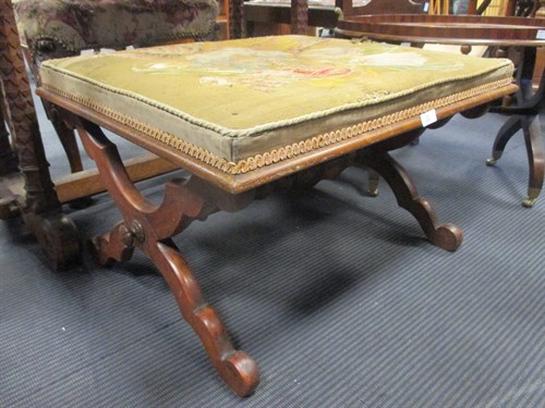 Lot 479 - A Victorian X frame stool with needlework seat...